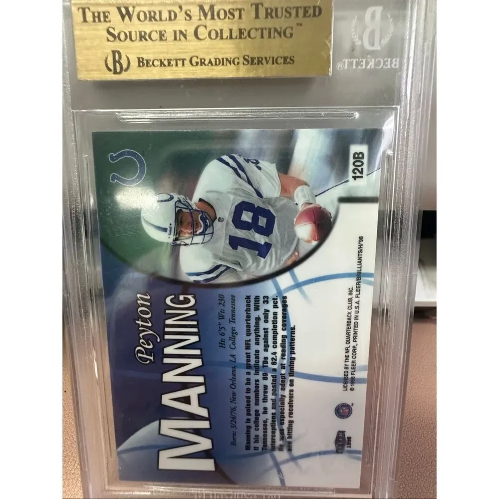 1998 Peyton Manning Fleer Brilliant Blue Rookie card. Beckett 9.5